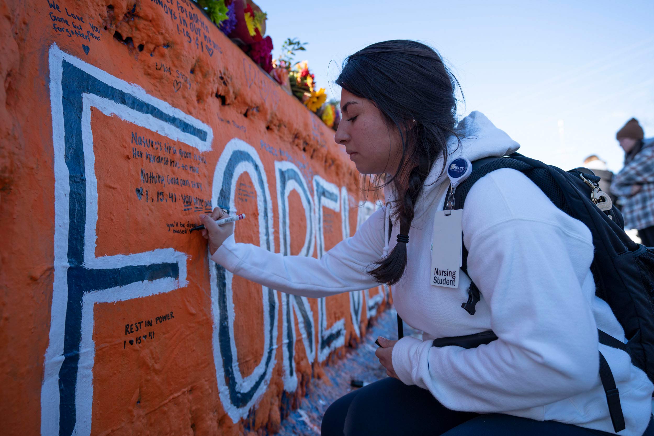 Samantha Trejo-Martinez writes on Beta Bridge in honor of the shooting victims.