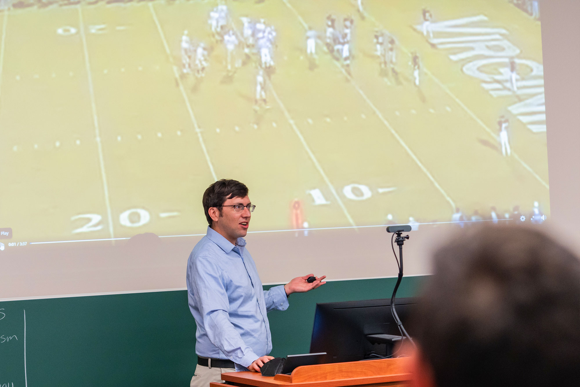 Richard Re teaching in front of a class