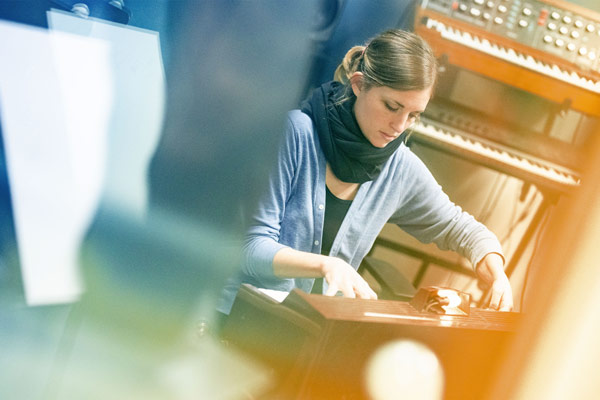 Molly Joyce playing a toy electric organ