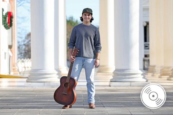 Luke Richard Powers poses with his guitar