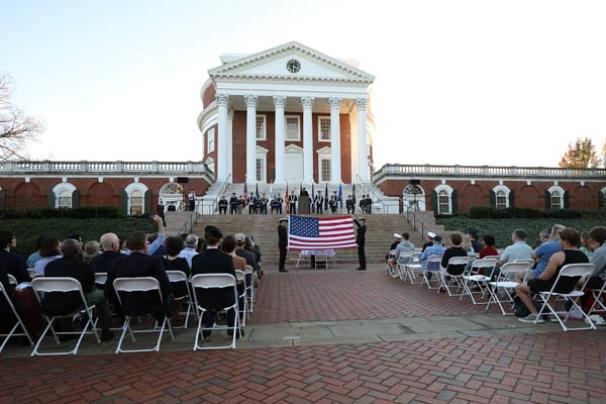 Cadets, midshipmen and guests, including University President Jim Ryan, attend a Veterans Day ceremony on the north plaza of the Rotunda 