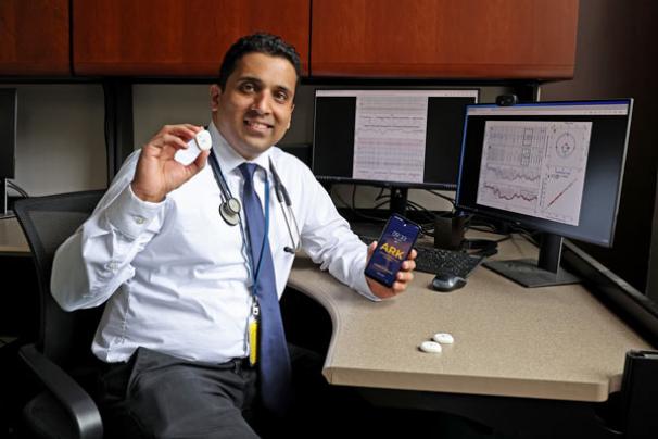 Dr. Shrirang Gadrey holding up his device