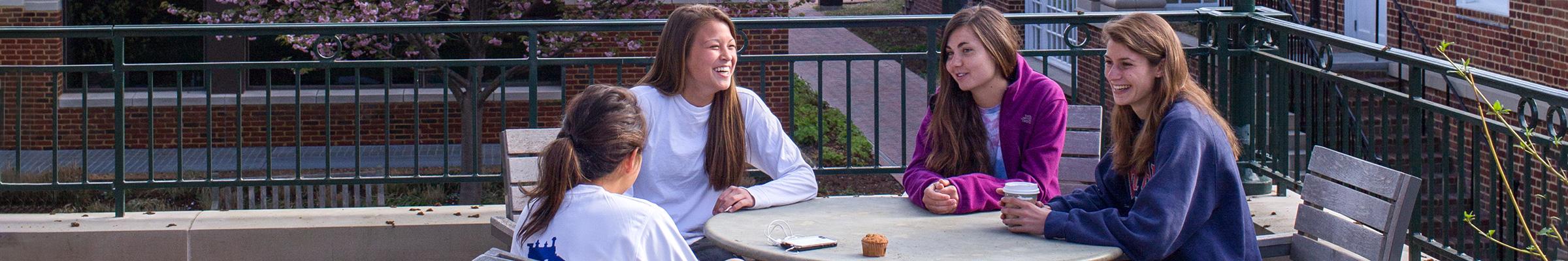 A banner portrait of a female student chatting.